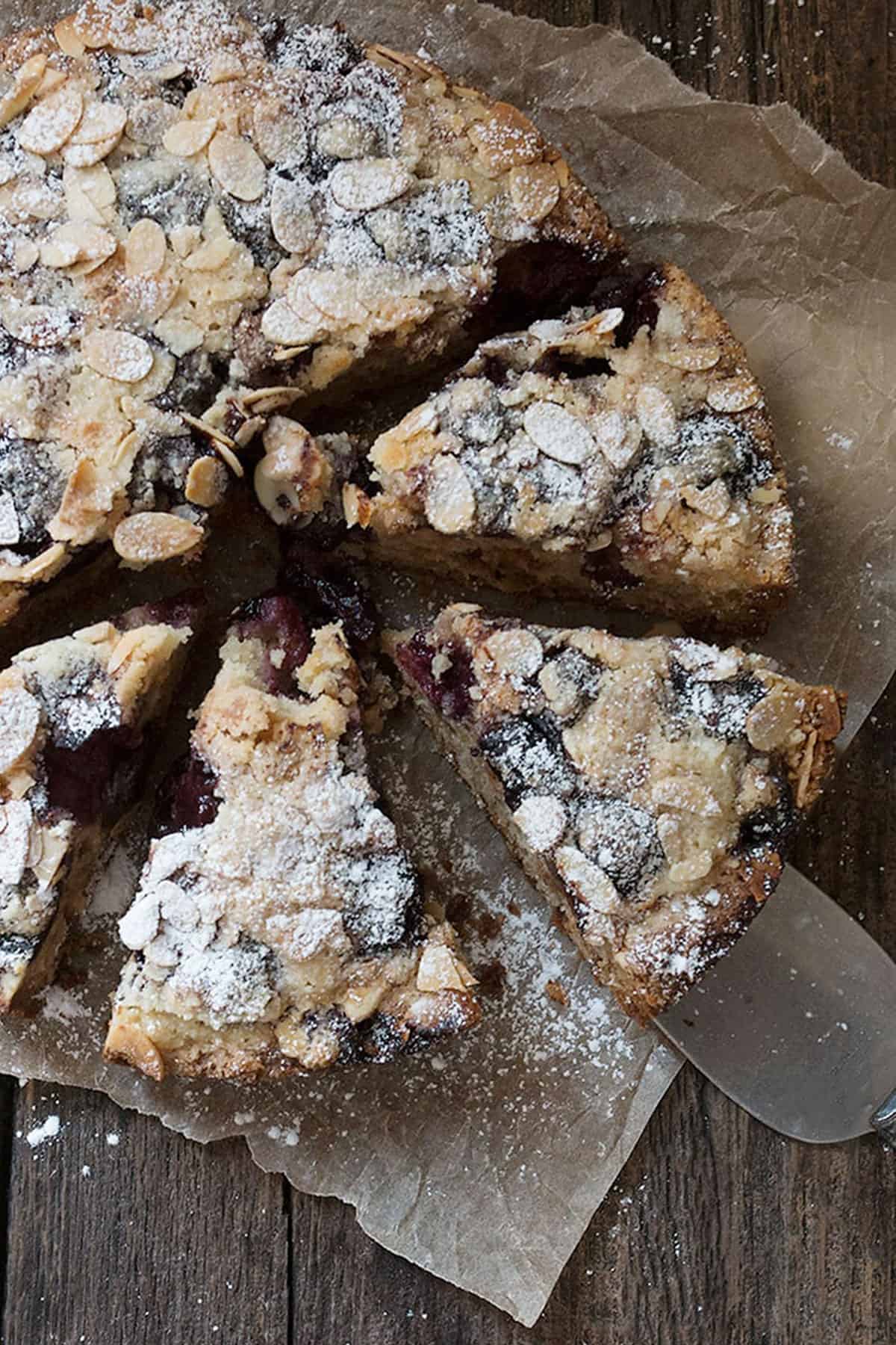 cherry almond coffee cakes sliced on parchment paper