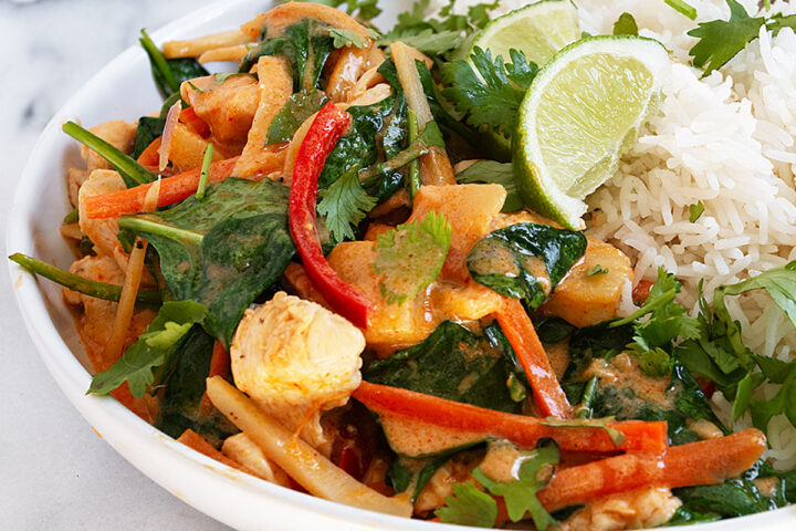 Thai red curry chicken in bowl with rice