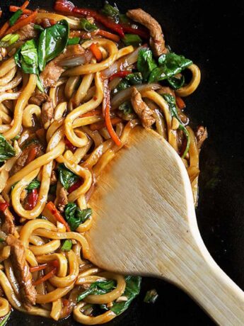 spicy pork udon in cast iron wok
