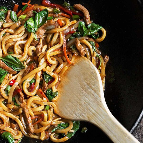 spicy pork udon in cast iron wok