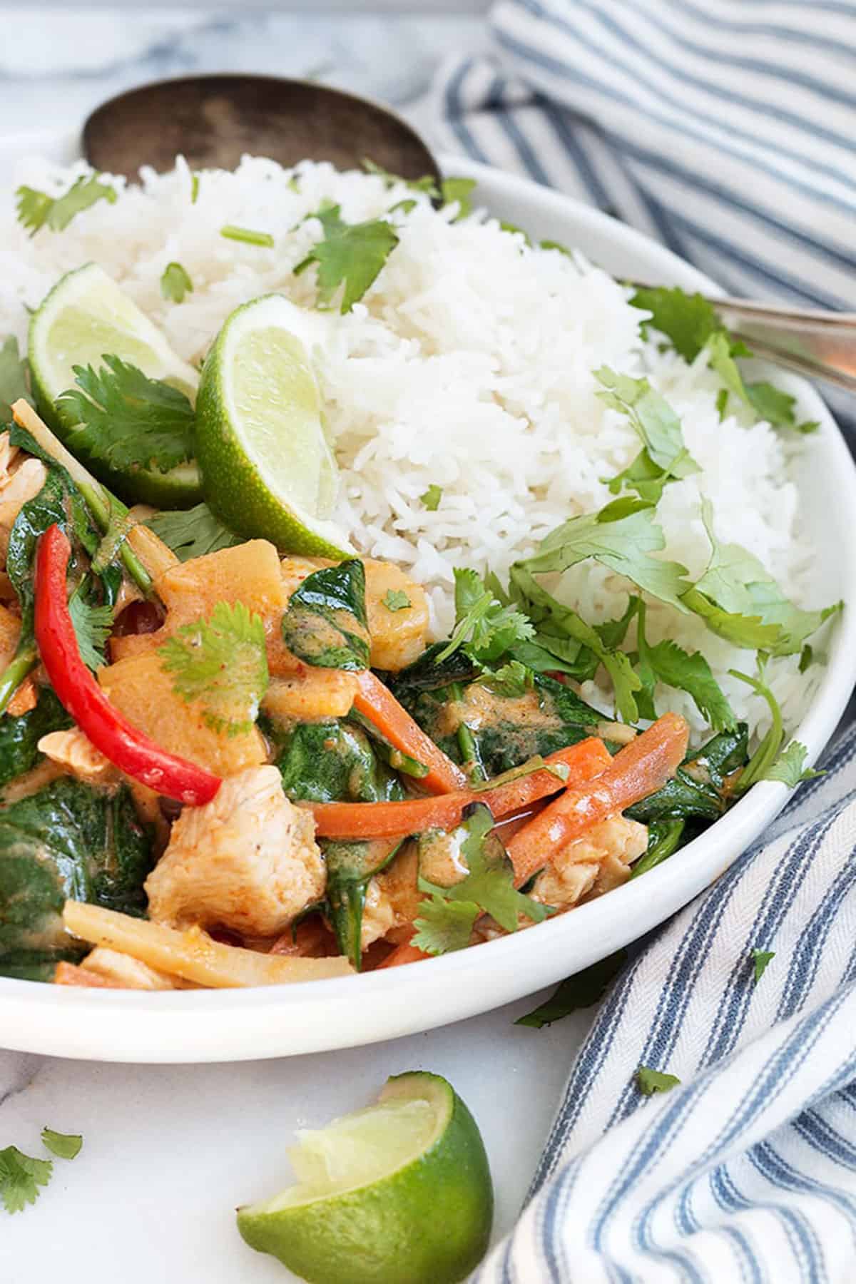 Thai red curry chicken in white bowl