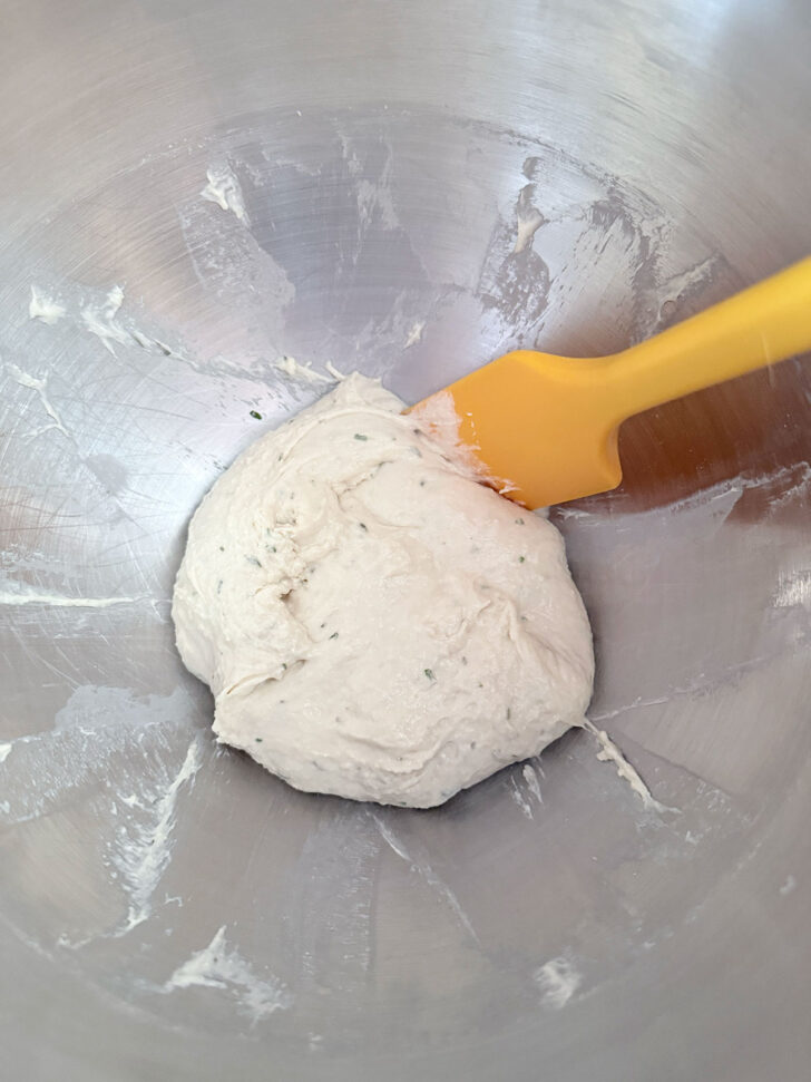 Focaccia dough after mixing in mixer bowl.