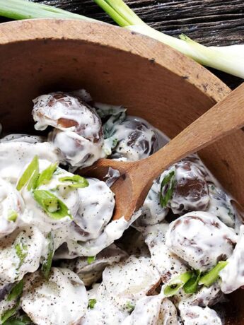 sour cream potato salad in wooden bowl