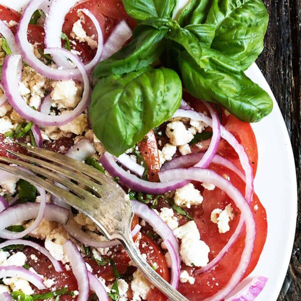 tomato feta salad on white plate