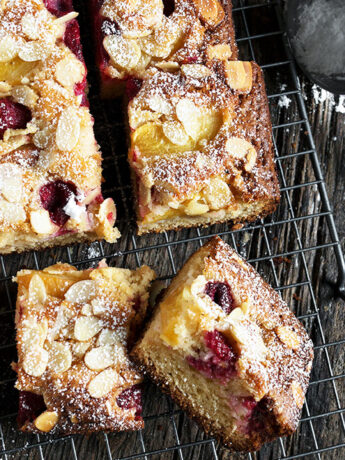 peach melba cake sliced on cooling rack