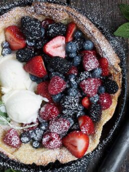 fresh fruit Dutch baby in cast iron skillet