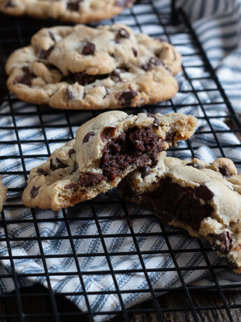 brownie stuffed chocolate chip cookies on cooling rack
