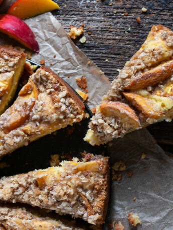 peach buttermilk cake sliced on parchment