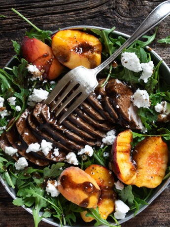 balsamic pork and peach salad with arugula and goat cheese