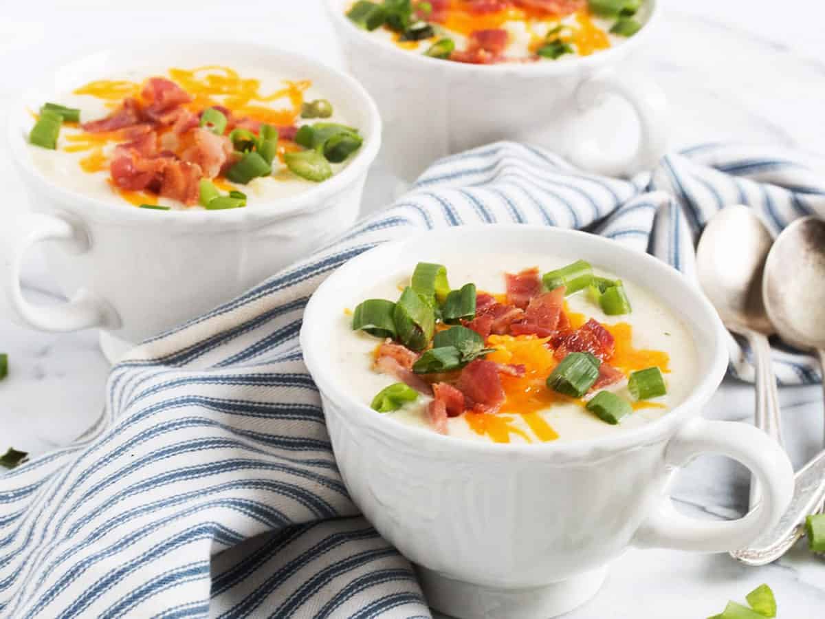 loaded cauliflower soup with bacon cheese and onion topping