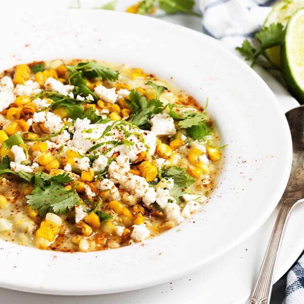 Mexican street corn soup in white bowl