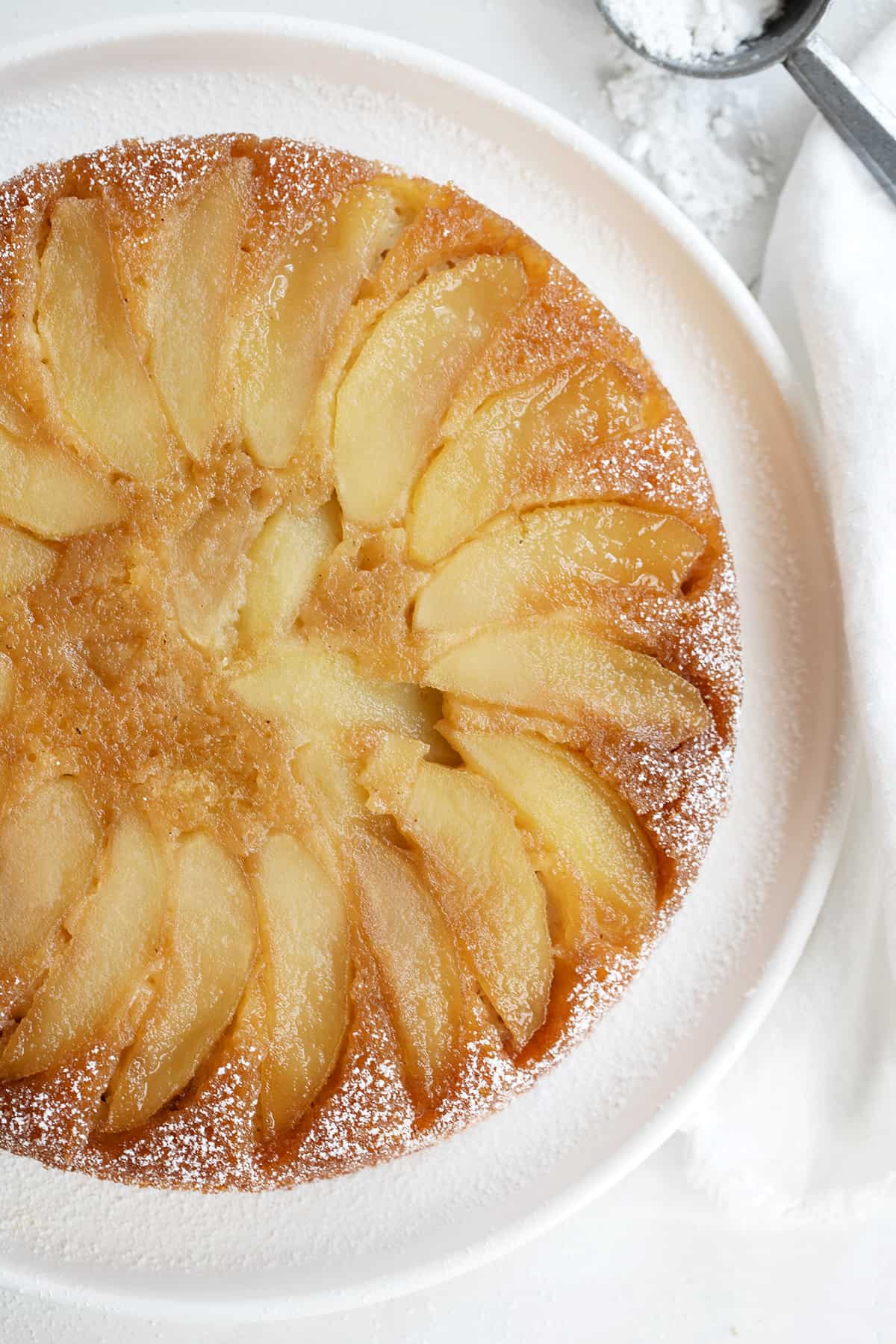 upside-down maple apple cake on white plate