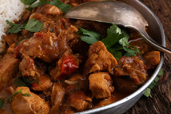 coconut chicken curry on platter with rice