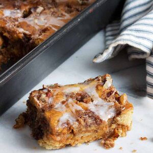 pumpkin sour cream coffee cake in baking pan with slice out