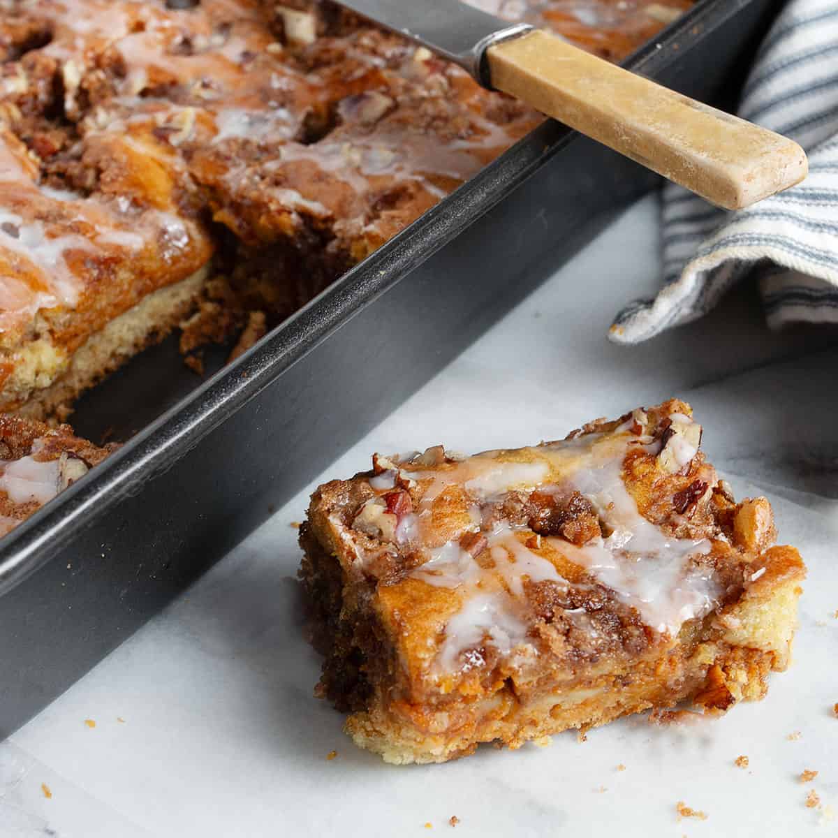 pumpkin coffee cake in pan and a slice out