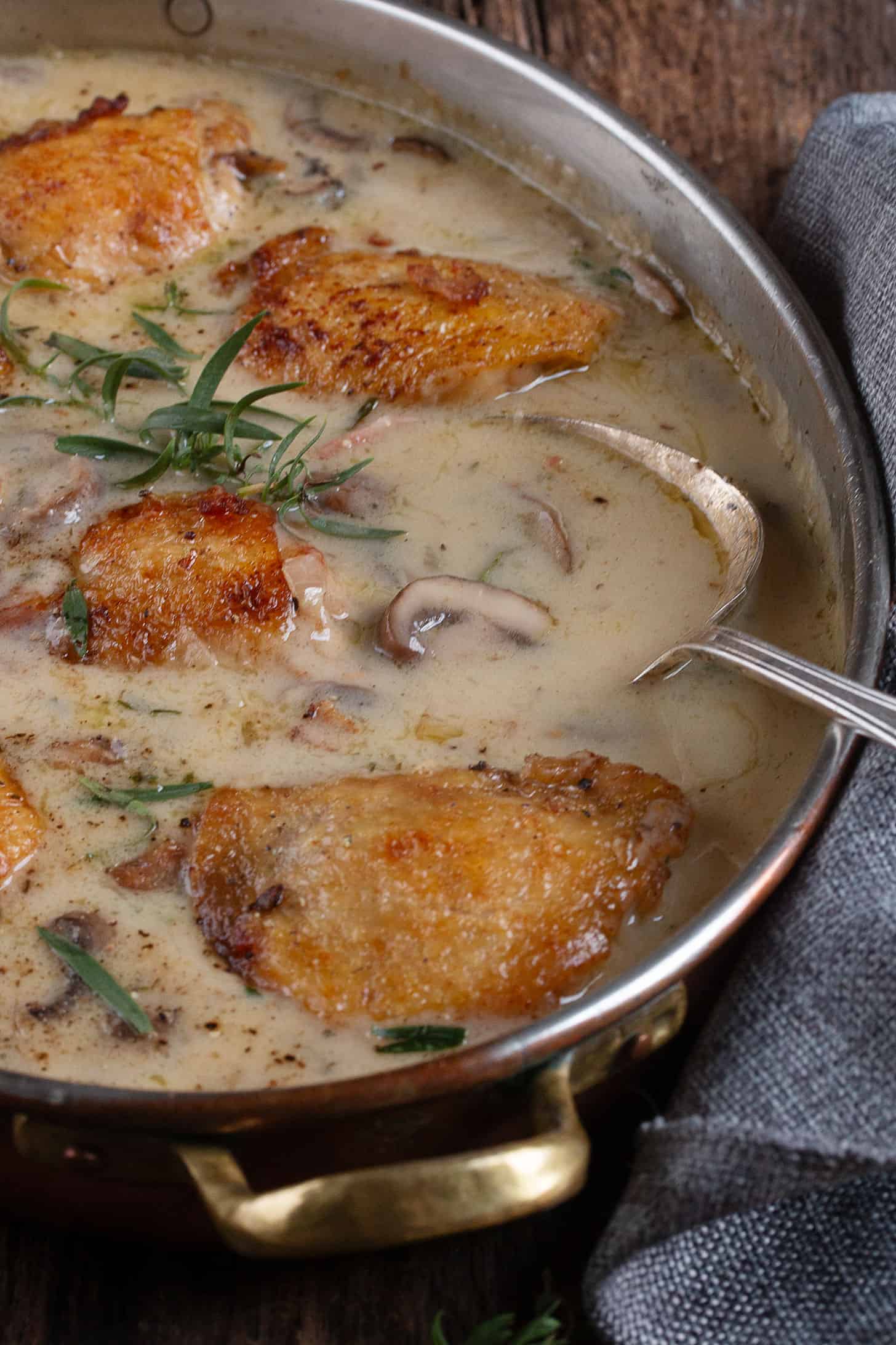 Saucy French chicken in a serving bowl.