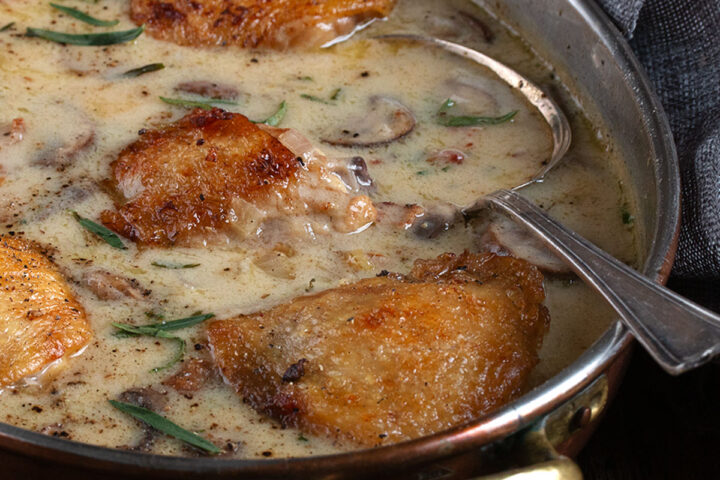 Saucy French chicken in a serving bowl.