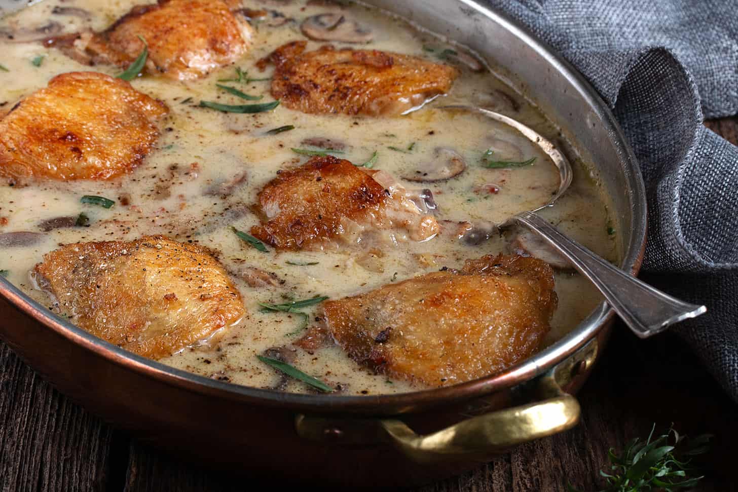 Saucy French chicken in a serving bowl.