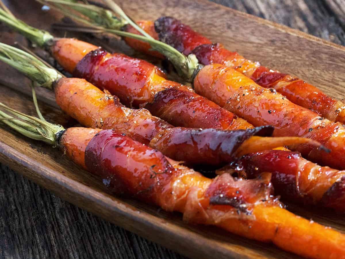 bacon wrapped maple glazed carrots in serving bowl