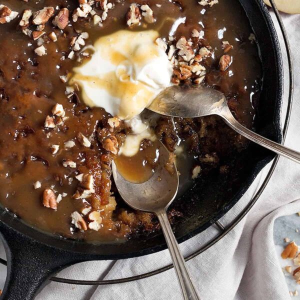 sticky toffee apple pudding in cast iron skillet