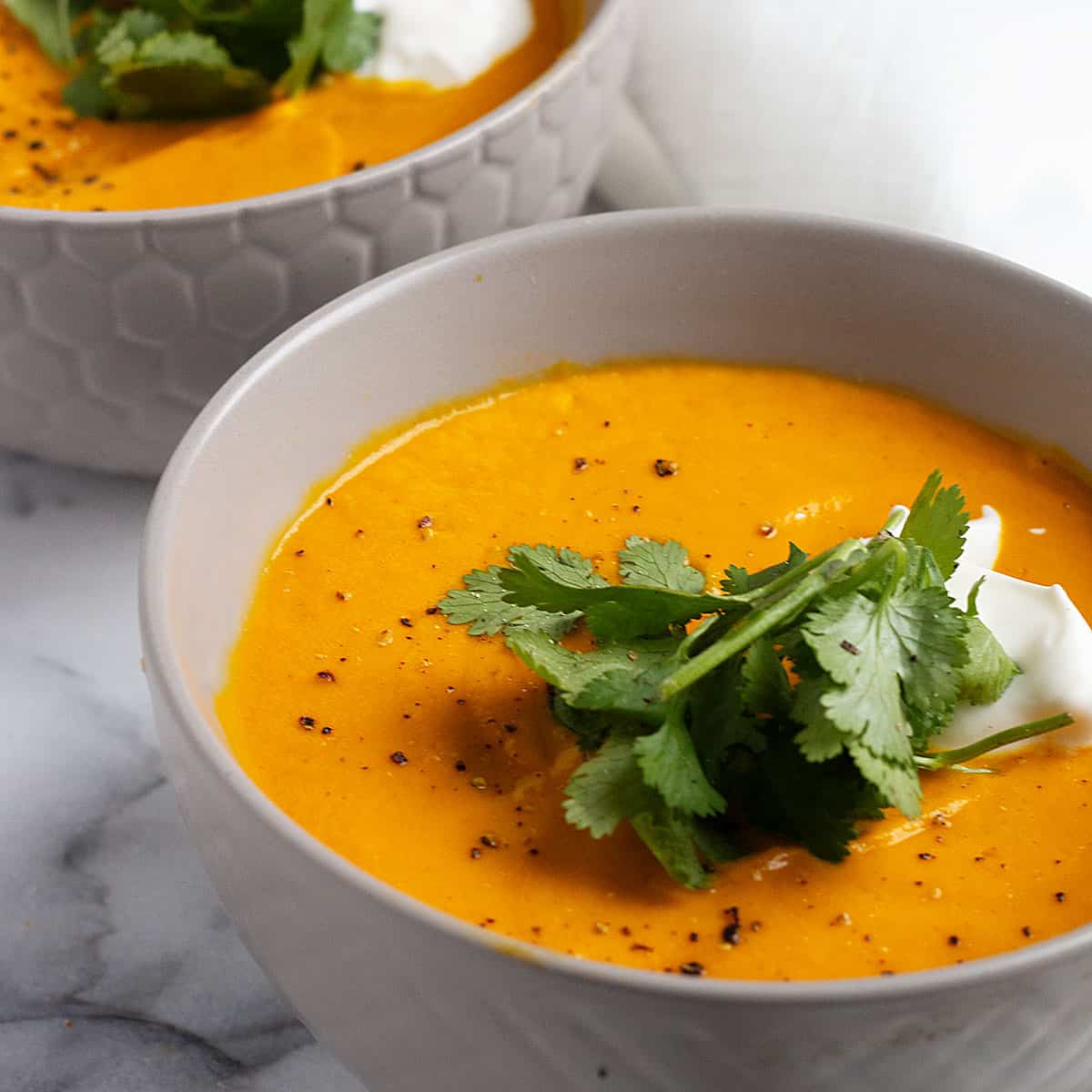 https://www.seasonsandsuppers.ca/wp-content/uploads/2018/10/thai-carrot-soup-1200-55.jpg