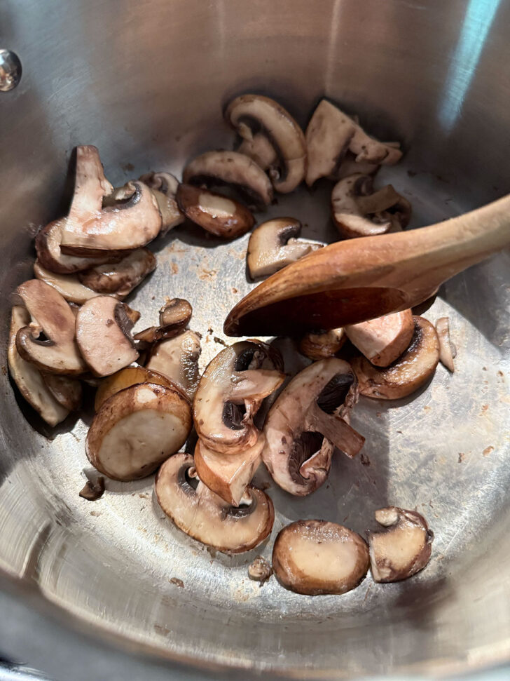 Cooking mushrooms in the soup pot.