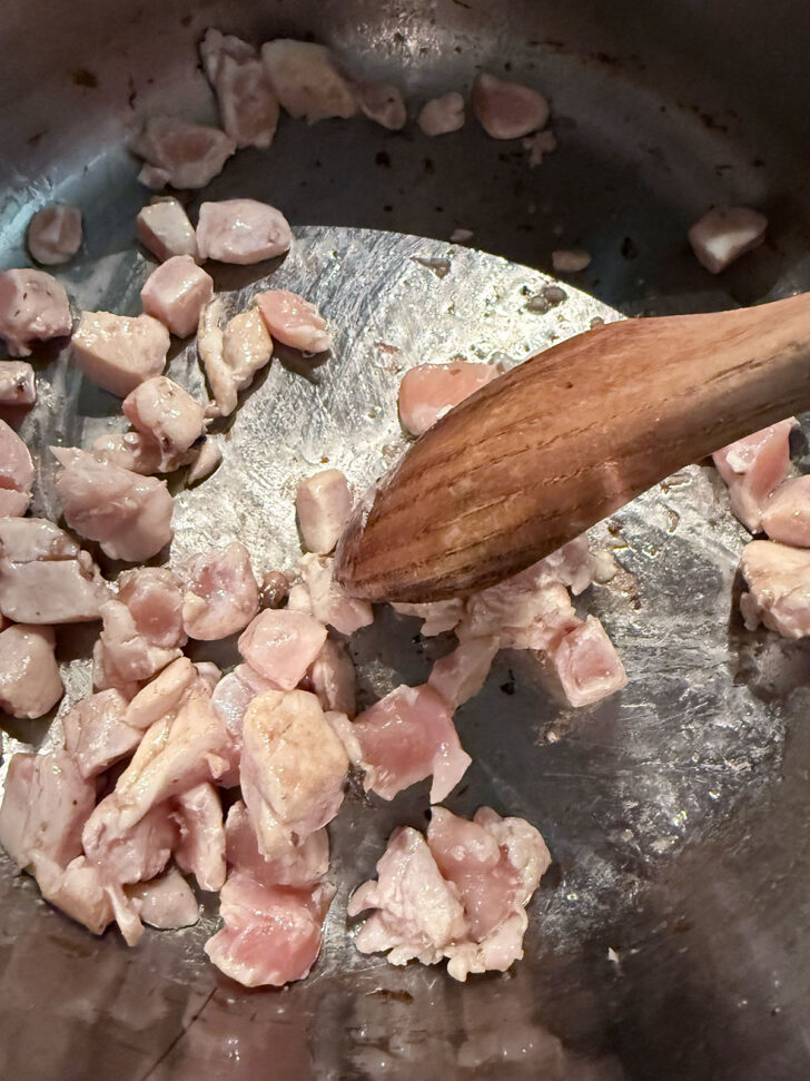 Cooking chicken in the soup pot.