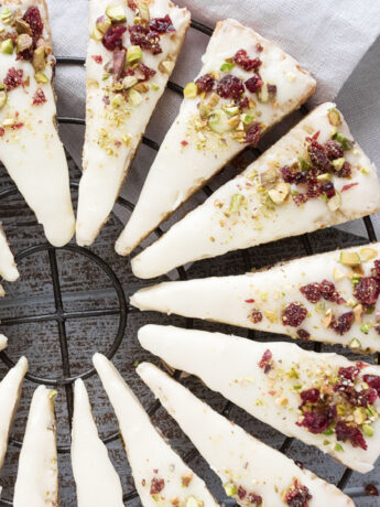 cranberry pistachio shortbread wedges on cooling rack