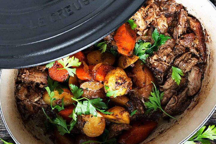 marsala braised pork in pot with carrots and potatoes