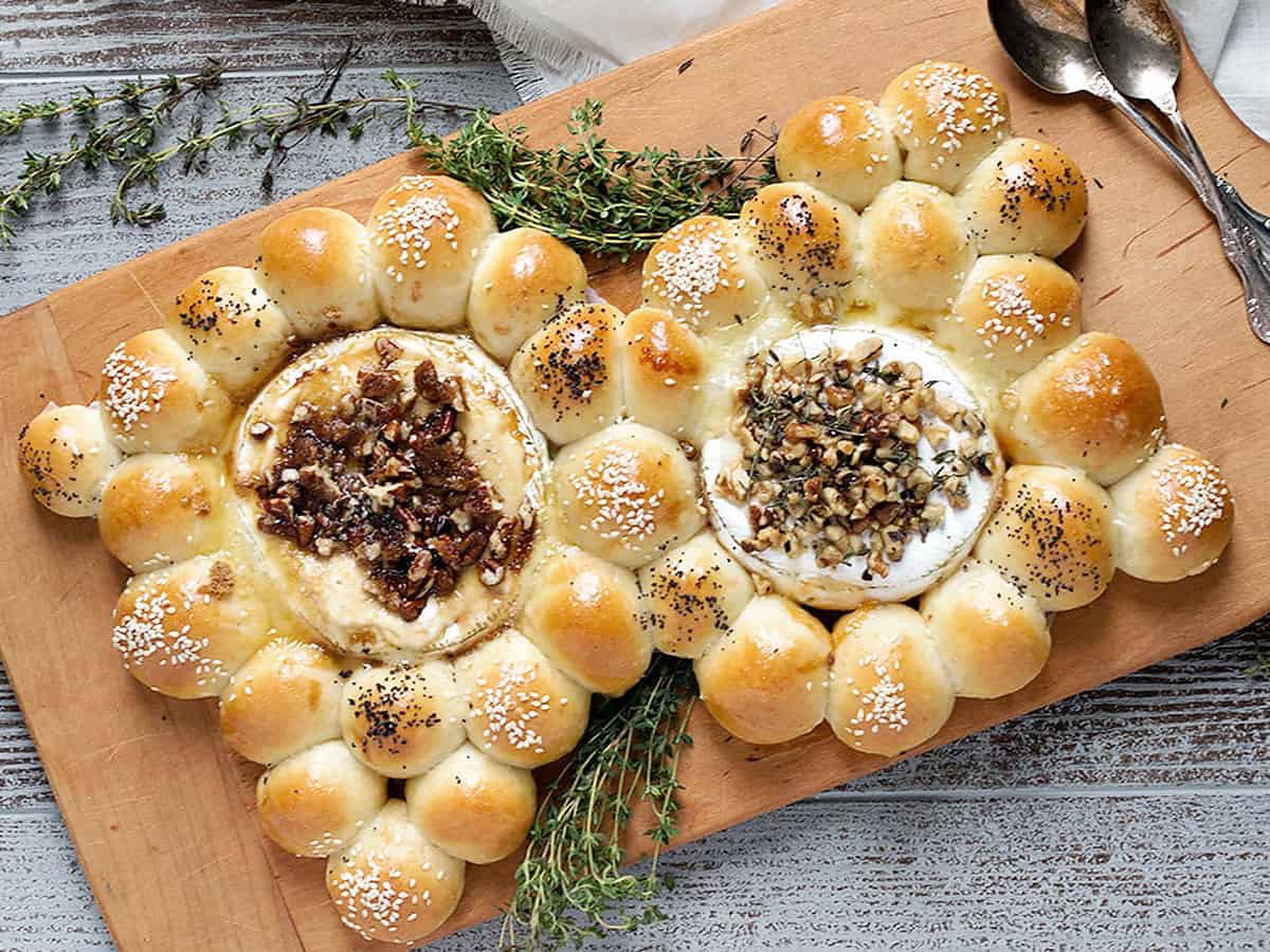 bread bites with baked brie on cutting board