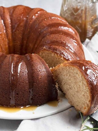 Ginger bundt cake sliced with brown sugar sauce