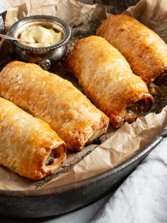 puff pastry sausage rolls in serving dish