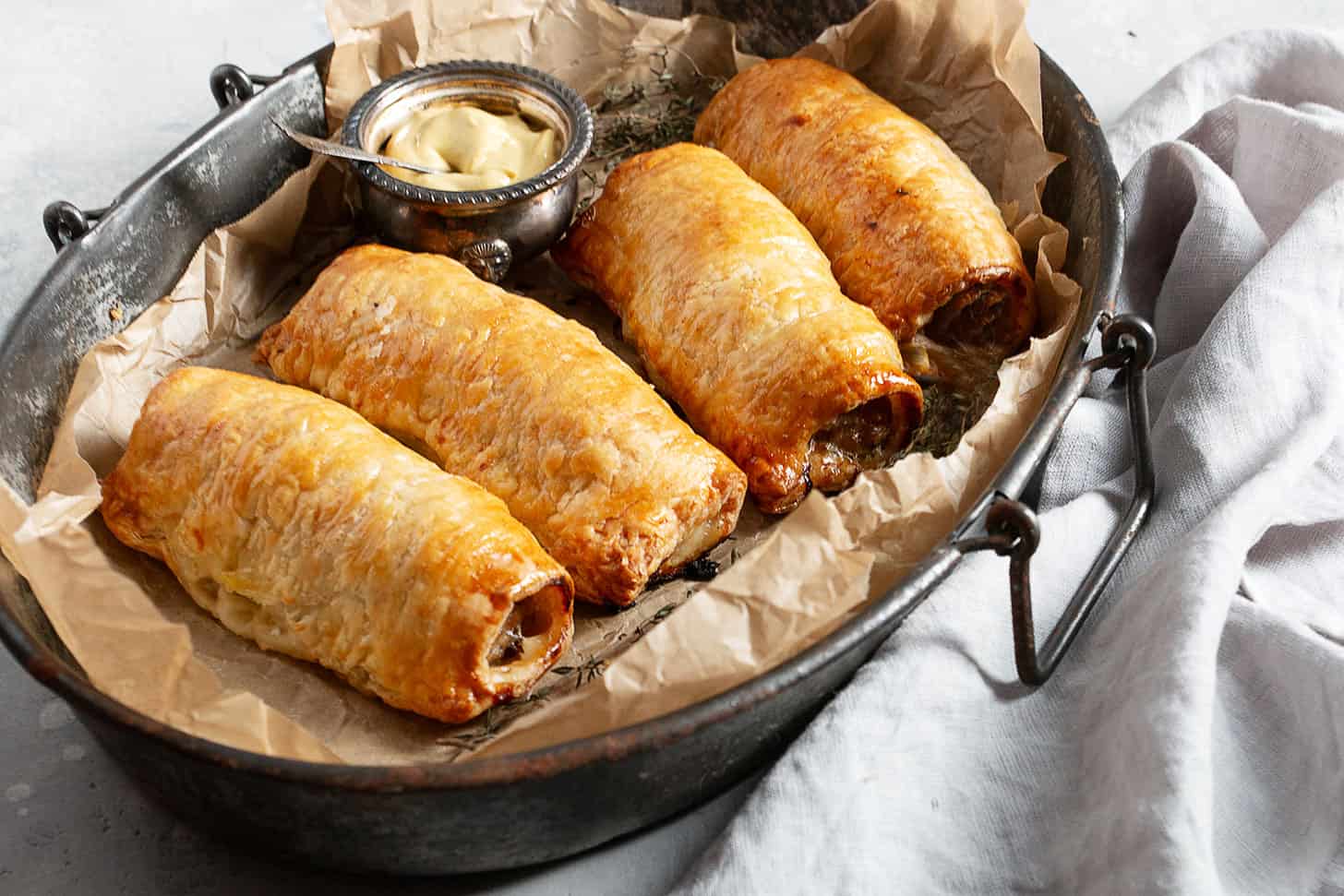 puff pastry sausage rolls in serving dish