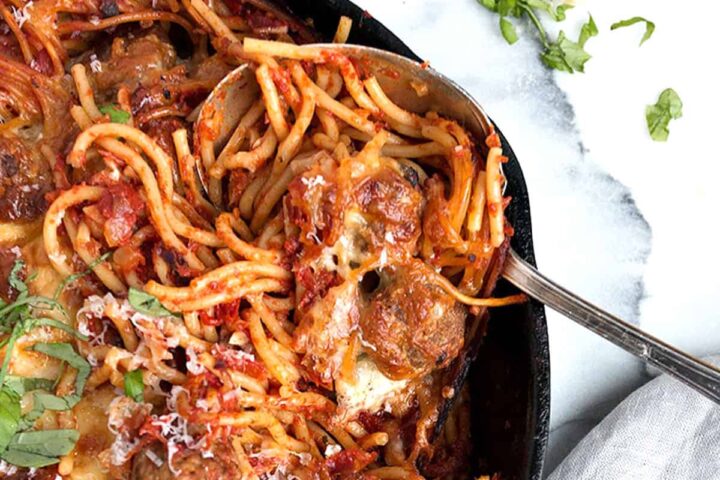 baked spaghetti and meatballs in cast iron skillet