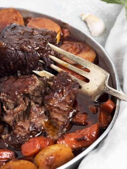 red wine braised short ribs on platter with carrots