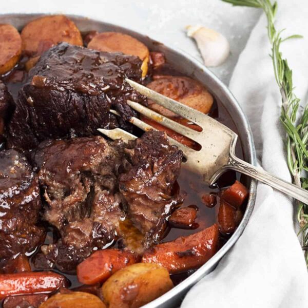 red wine braised short ribs on platter with carrots