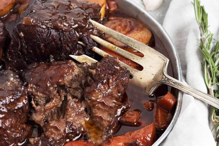 red wine braised short ribs on platter with carrots