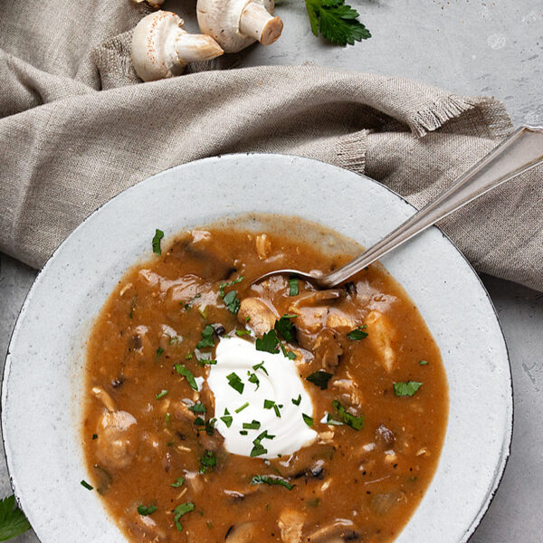 Hungarian mushroom soup in bowl with spoon