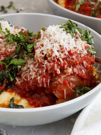 pork meatballs in bowl with polenta