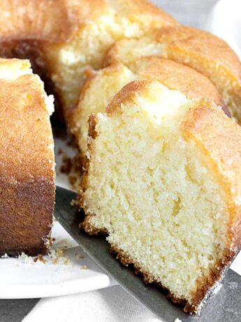 lemon tube cake sliced on white plate