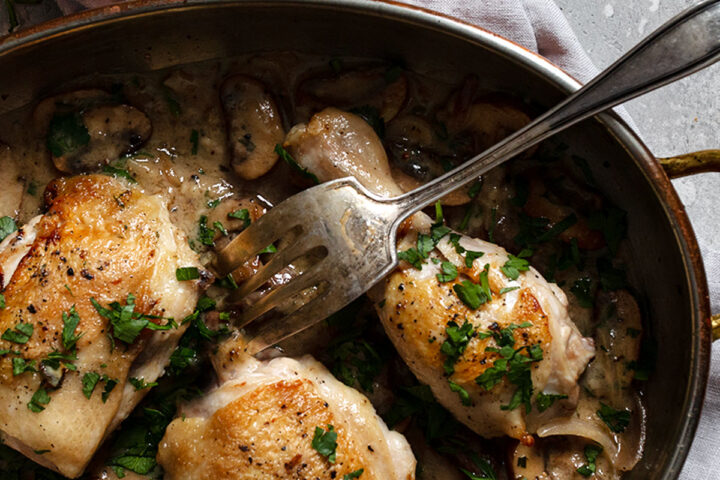 chicken riesling in pan with fork