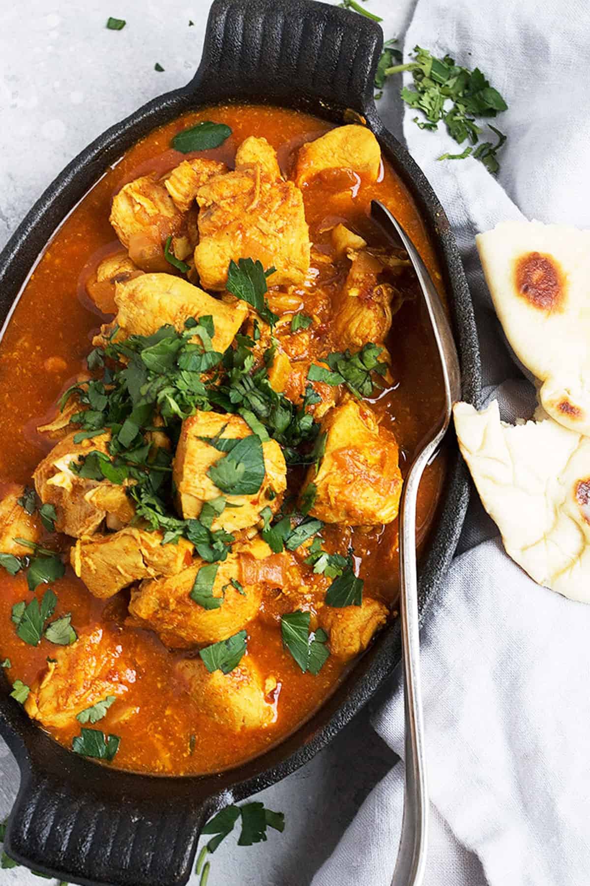 chicken vindaloo in cast iron dish