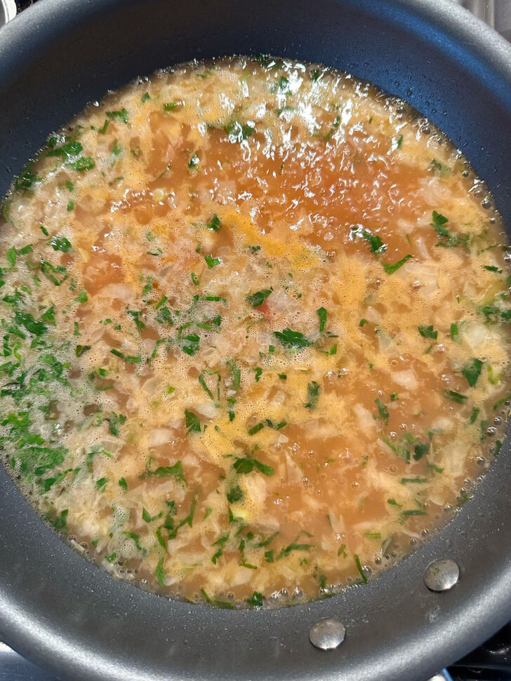 Sauce mixture simmering in skillet.