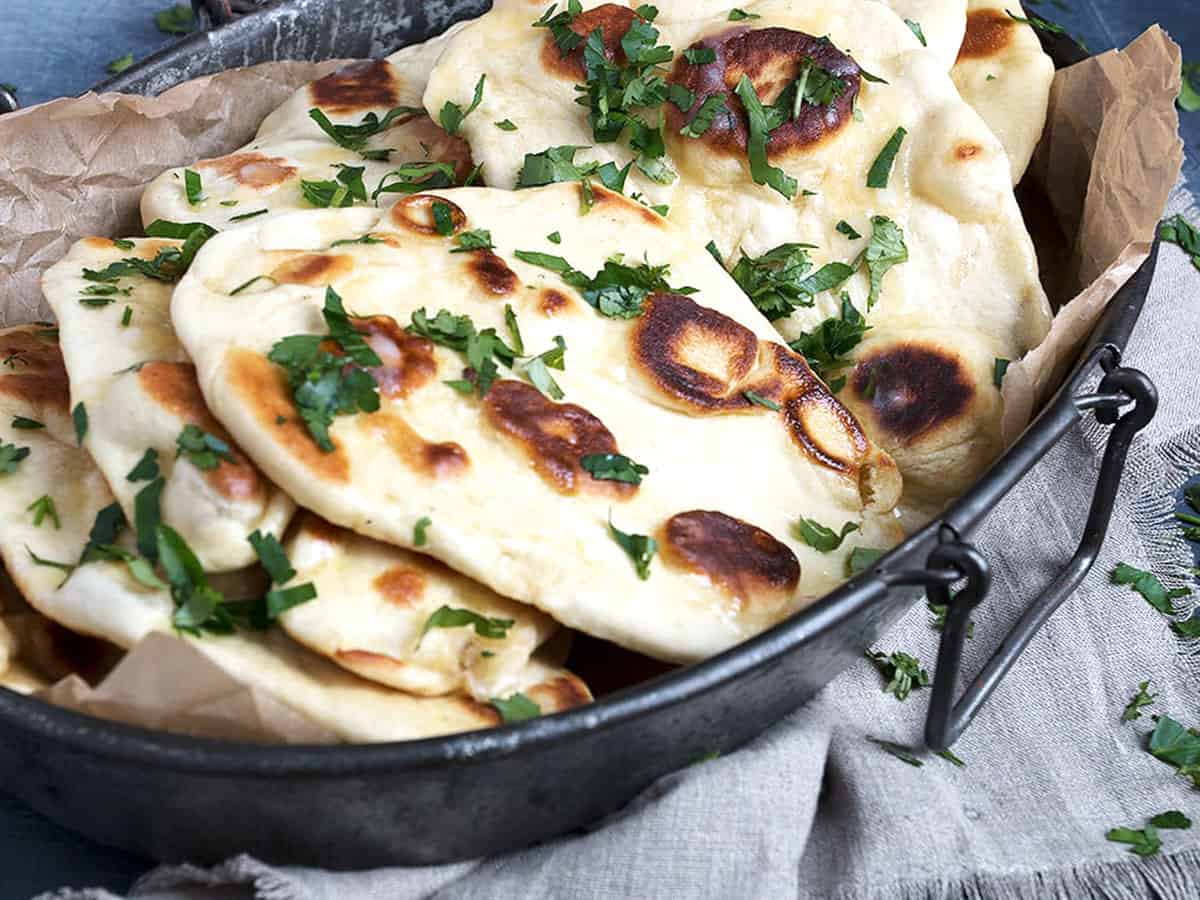 naan bread on metal platter