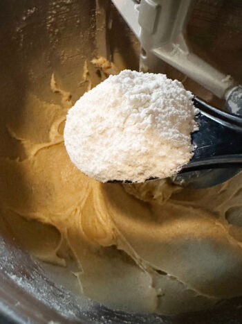 adding dry ingredients to batter