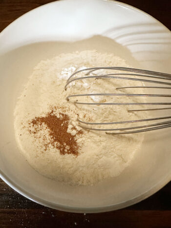 whisking together dry ingredients in bowl