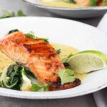 sugar-seared salmon in bowl with coconut lime sauce