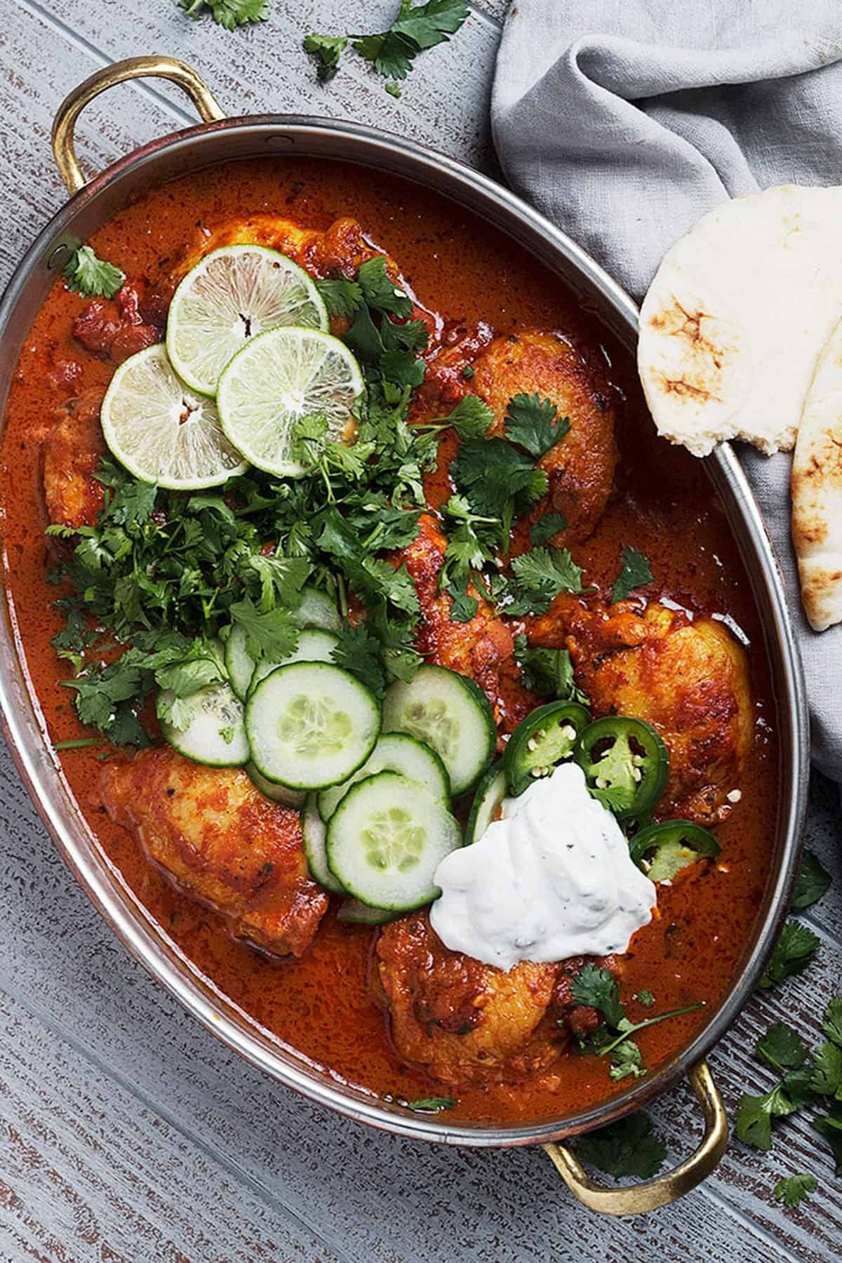 butter chicken thighs in baking dish