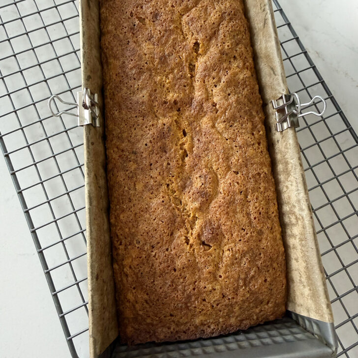 Baked carrot cake loaf in the loaf pan.