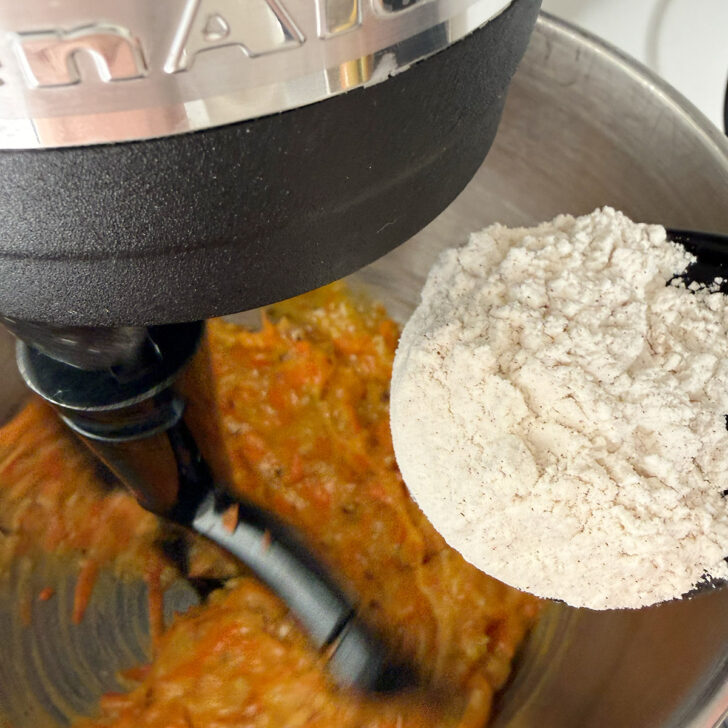 Adding the flour mixture to the batter.